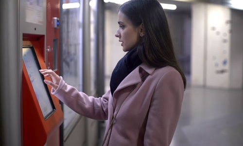 Female withdrawing money from automated teller machine, banking operations (1).jpg