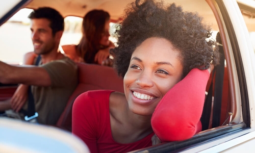 group of friends having fun in a car_cheapest and best cars to insure.jpg