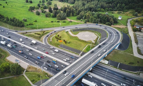Aerial shot of on-ramp to major highway with lots of traffic