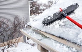utters with ice dam and broom for raking snow off of a roof.jpg